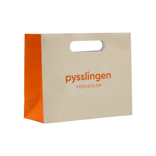 Papperspåsar DELUXE stansade handtag 42+12x41cm – Profileproduction